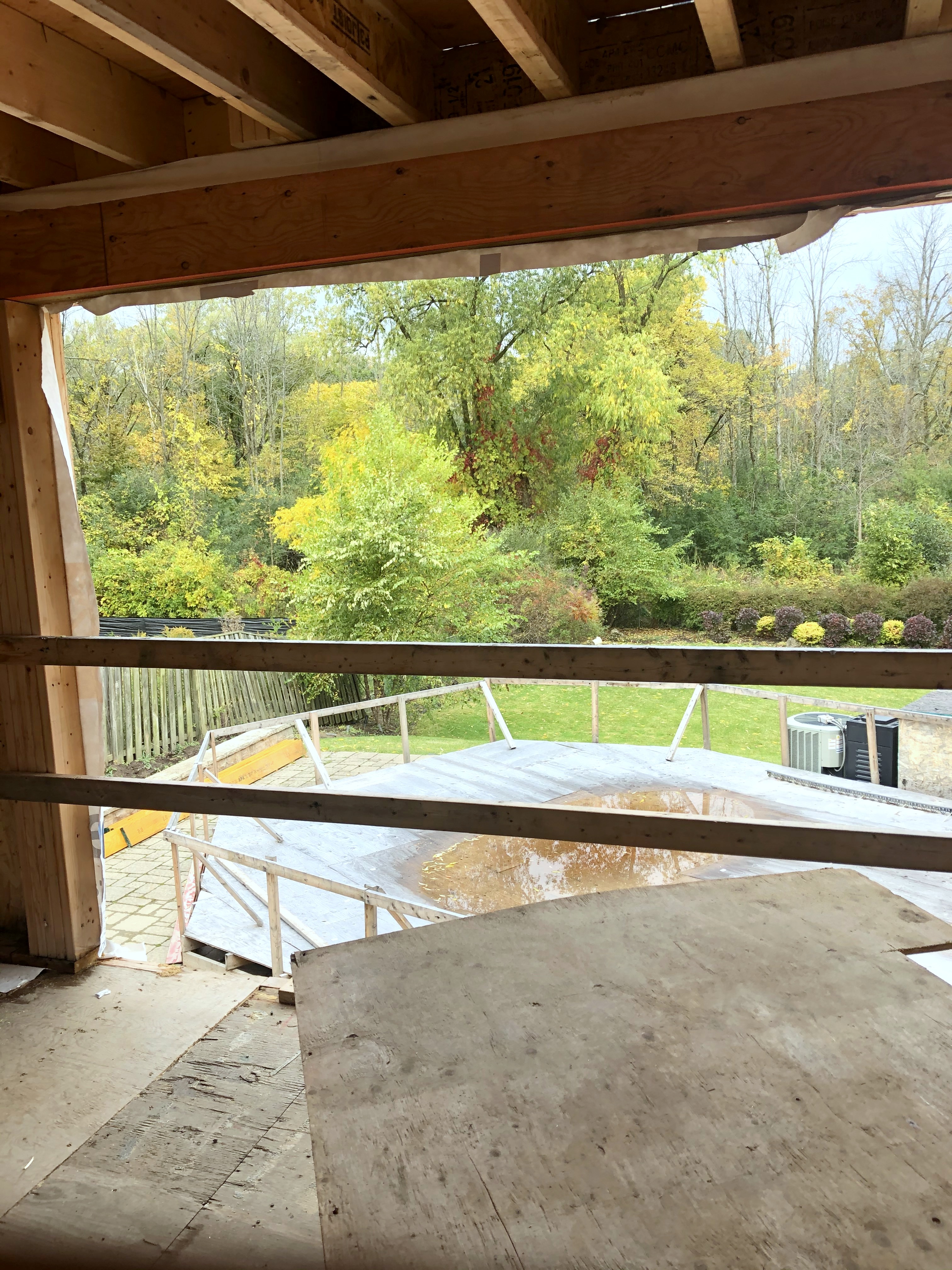 view of backyard from inside house under construction
